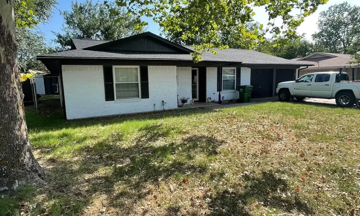 Professional roofing crew working on a residential roof in San Luis Obispo